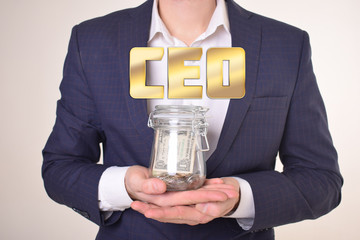 A businessman with a bank of money shows an inscription:CEO