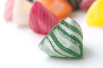 closeup of colorful traditional candies on white background
