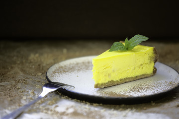 Yellow lemon cheesecake on a plate