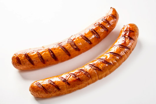 Two seared barbecue sausages with copy space