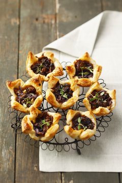 Puff pastry tartlets with sundried tomatoes, caramelised onions and thyme