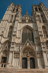 Fototapeta na wymiar Gothic facade of St. Michael and St. Gudula’s Cathedral and blue sunny sky in Brussels. Vibrant and friendly, is the country’s capital and administrative center of the EU. Central Belgium.