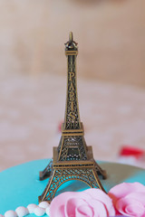 Eiffel tower souvenir toy, isolated on a yellow background