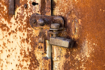Rusty old castle on the iron doors. Country style. Close-up. Iron texture.