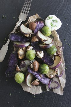 Oven-roasted winter vegetables with dill yoghurt dip