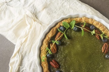 Green tea vegetarian pie match with nuts and mint