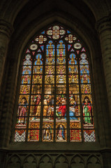 Fototapeta na wymiar Colorful stained glass window in the St. Michael and St. Gudula Cathedral at Brussels. It is the country’s capital and administrative center of the EU. Central Belgium