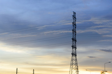 The electricity pylon with the sunset scene.