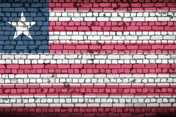 Liberia flag is painted onto an old brick wall