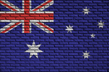 Australia flag is painted onto an old brick wall