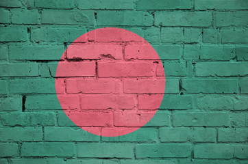 Bangladesh flag is painted onto an old brick wall