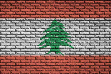 Lebanon flag is painted onto an old brick wall