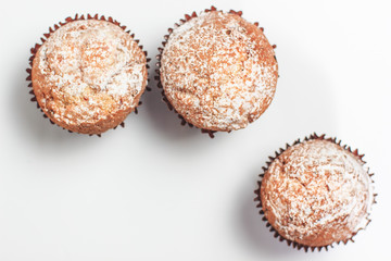 Fresh homemade delicious muffins with sugar powder