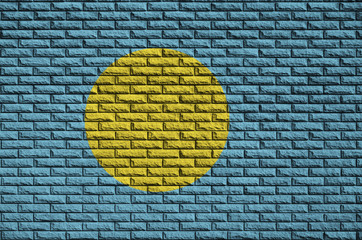 Palau flag is painted onto an old brick wall