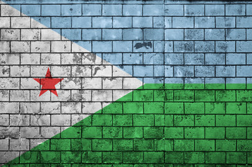 Djibouti flag is painted onto an old brick wall