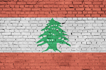 Lebanon flag is painted onto an old brick wall