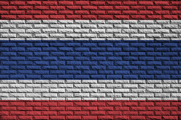 Thailand flag is painted onto an old brick wall