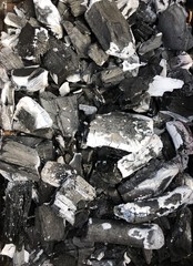 Black coal with ash in the grill