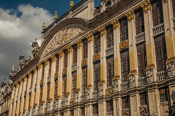 Fototapeta na wymiar Close-up of the rich and elegant decoration on the historic buildings at Grand Place of Brussels. Vibrant and friendly, is the country’s capital and administrative center of the EU. Central Belgium.