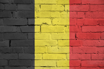 Belgium flag is painted onto an old brick wall