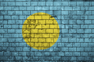 Palau flag is painted onto an old brick wall