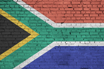 South Africa flag is painted onto an old brick wall