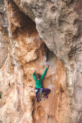 A climber climbs the rock.
