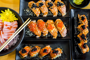Sushi row mixed wrapped with salmon and sliced fish sashimi,Japanese food,Selective focus