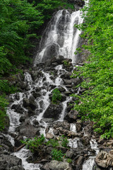 Fototapeta na wymiar Milk waterfall in Georgia. Ritsa Relict National Park
