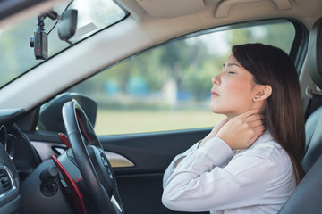 Asian woman pained her neck after driving