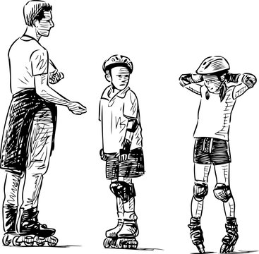 A trainer teaches the kids to skate on rollers