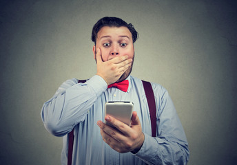 Shocked man having bad news on the phone