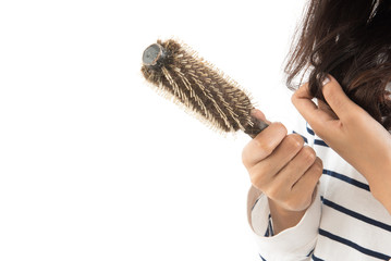 Portrait  of asian woman long hair with a comb and problem hair on white background. This image for hair loss concept.