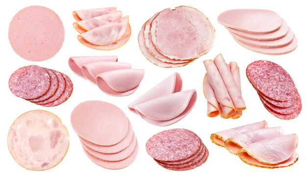 Slices of different sausage, ham and salami isolated on white background