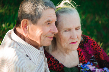 beautiful happy eighty years old people sitting in the  park