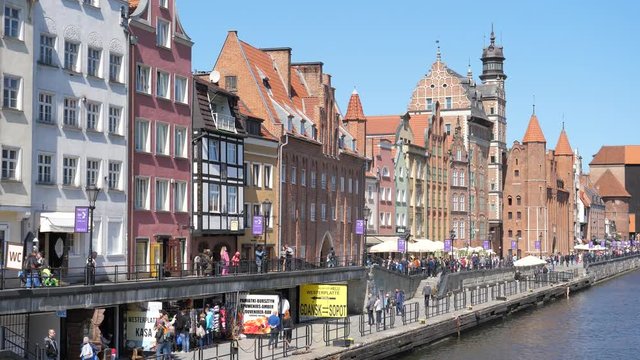 Center embankment tourists walk, restaurants and beautiful facades of buildings Gdansk Poland