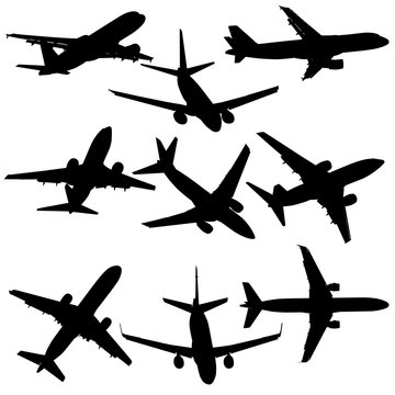 Set of silhouettes of planes from different eras on a white background