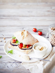Healthy vegan sandwich on rustic background.