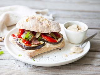 Healthy vegan sandwich on rustic background.