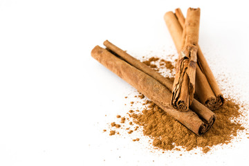 Cinnamon sticks and powder isolated on white background. Copyspace
