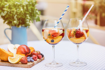 Top view of summer dinks, fruit cocktails on white wood table wi