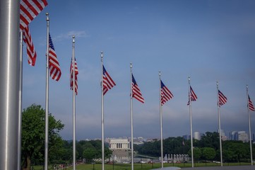 RIng of flags on national mall with lincolin memorial in the background