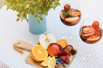 Top view of summer dinks, fruit cocktails on white wood table wi