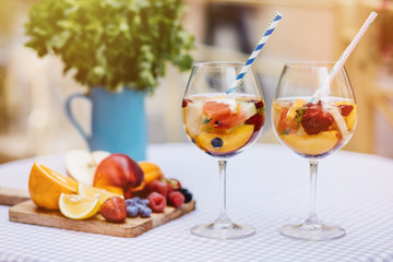 Top view of summer dinks, fruit cocktails on white wood table wi
