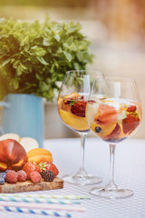 Top view of summer dinks, fruit cocktails on white wood table wi