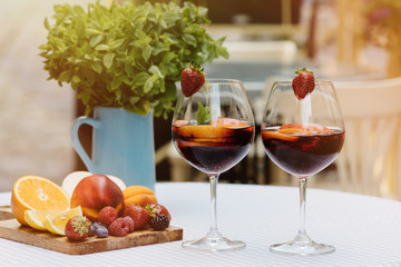 Top view of summer dinks, fruit cocktails on white wood table wi