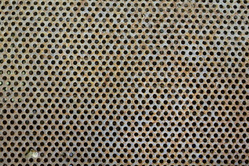 Background grid - a metal texture with a lot of round holes
