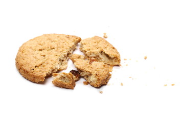 Round whole wheat biscuits with raisins isolated on white background