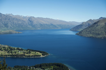Naklejka na ściany i meble Landscape of mountains and a blue lake form above