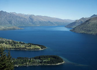 Naklejka na ściany i meble Landscape of mountains and a blue lake form above